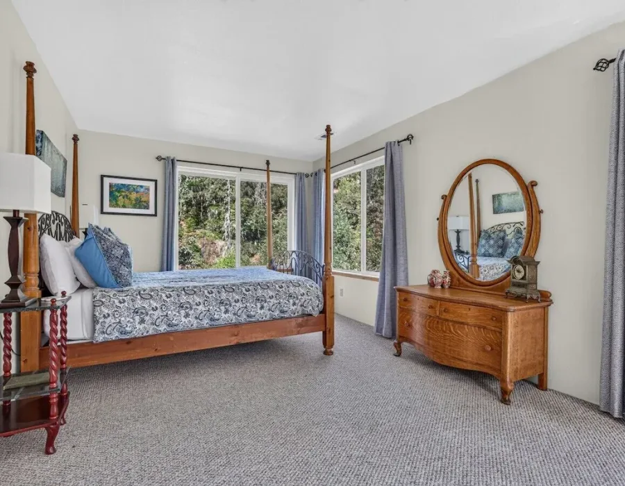 Master bedroom with four-poster bed and river views